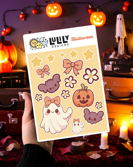 Sheet of Halloween-themed stickers held in front of a decorated Halloween scene with pumpkins and candles.