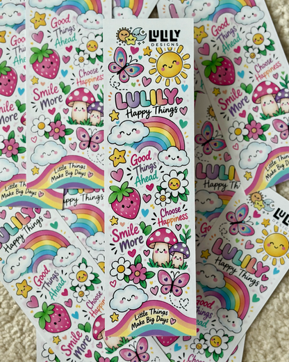 A collection of colorful sticker sheets featuring cute cartoon illustrations including rainbows, butterflies, strawberries, mushrooms, smiling suns, and text like 'LULU Happy Things' and 'Smile More' on a soft beige carpet background.