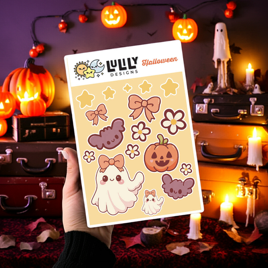 Sheet of Halloween-themed stickers held in front of a decorated Halloween scene with pumpkins and candles.