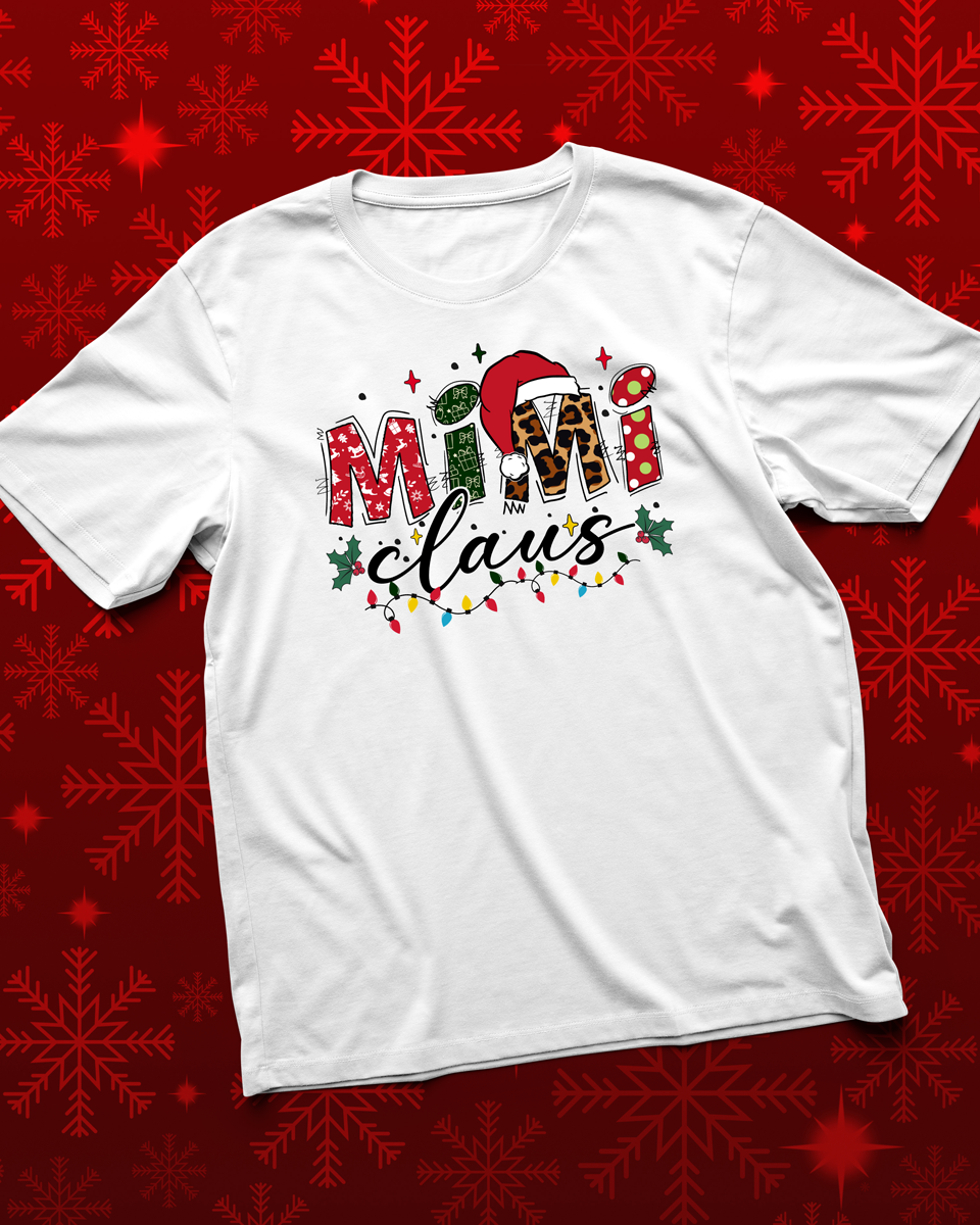 White t-shirt with 'Mama Claus' design on a red snowflake pattern background