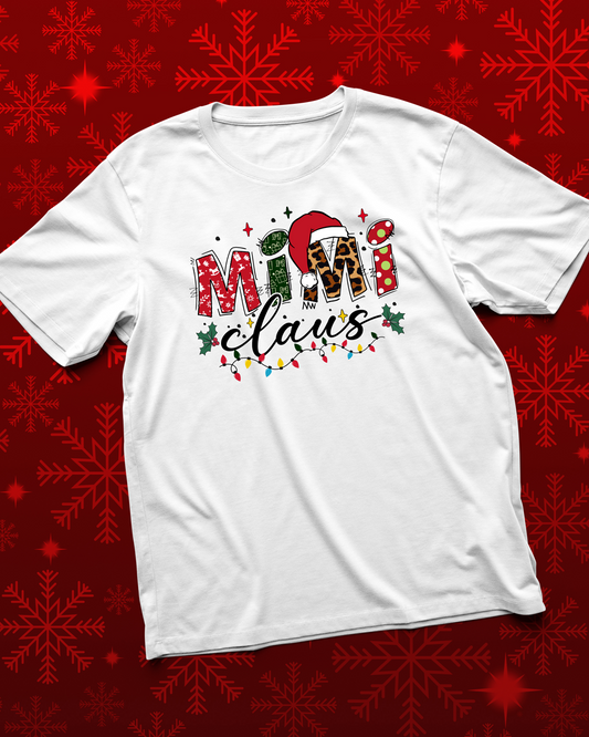 White t-shirt with 'Mama Claus' design on a red snowflake pattern background